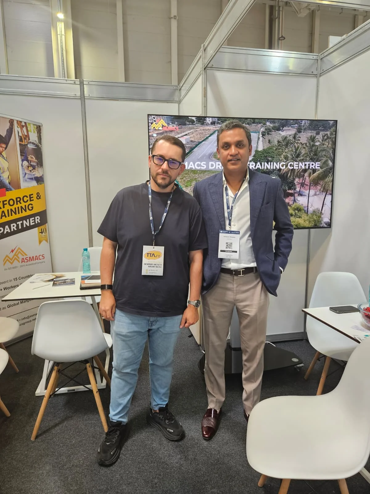 ASMACS team beside the ASMACS Driver Training Centre display at TransLogistica Romania 2026